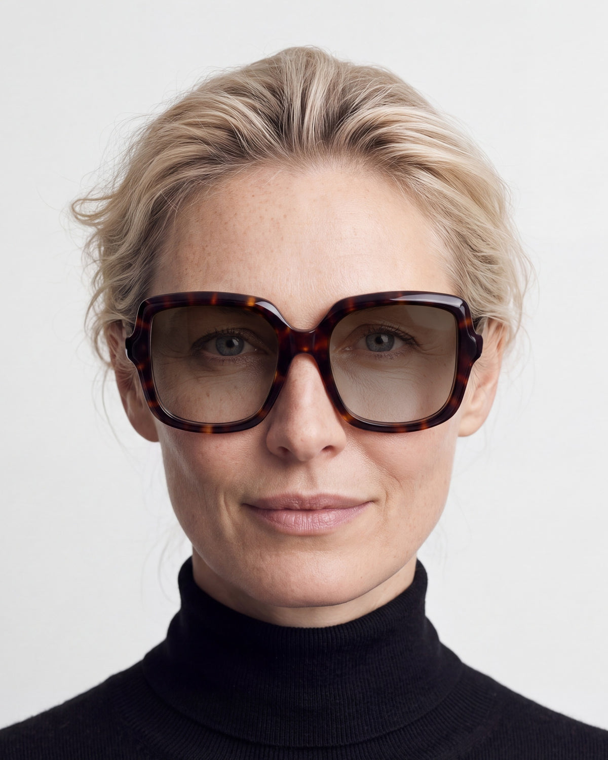 Elara in tortoiseshell, worn, sun lenses